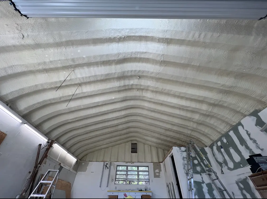 Spray polyurethane foam applied to the underside of a metal roof deck in Fort Rucker